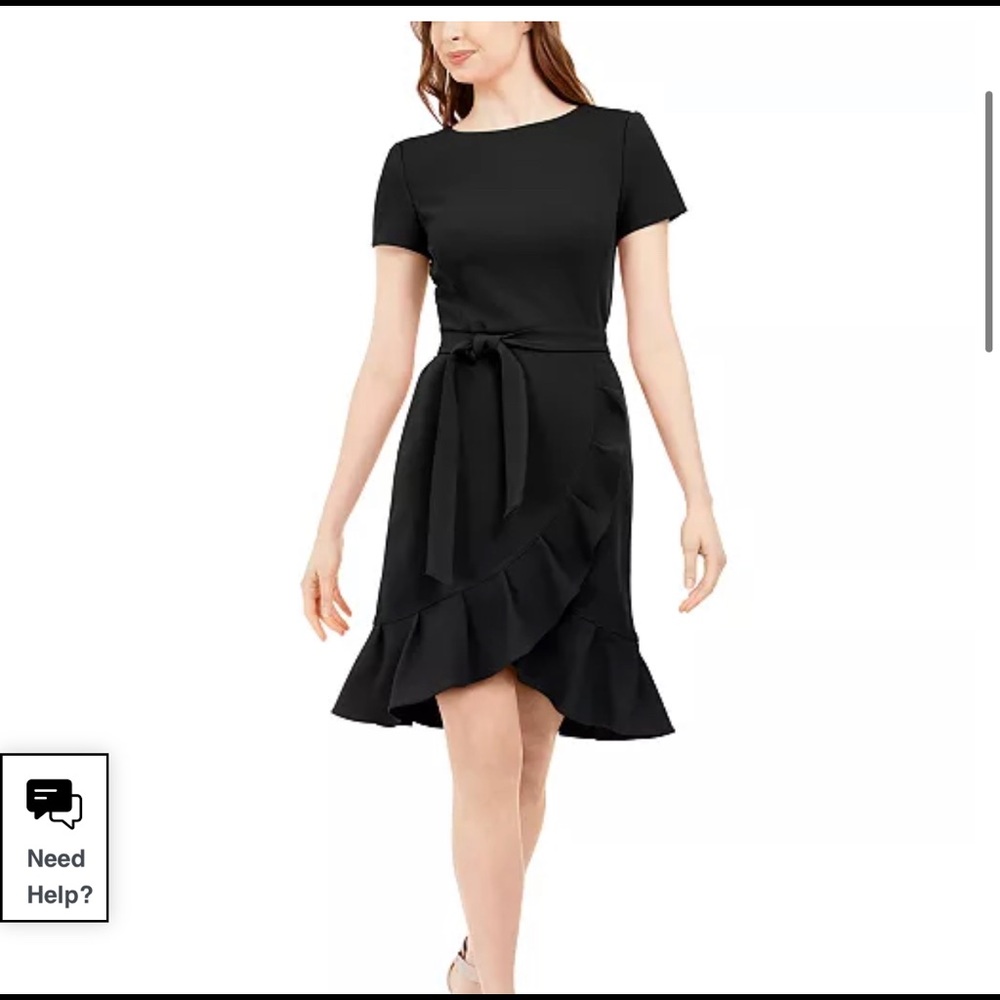 Short ruffled black dress with gold zipper. Never worn